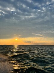 reflective water with sunset