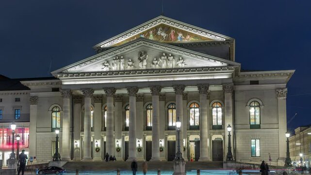 Munich National Theatre or Nationaltheater on Max Joseph square day to night transition timelapse. Historic opera house, home of the Bavarian State Opera. Evening illumination after sunset. Germany