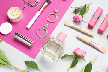 Naklejka premium Composition with female accessories, cosmetics, makeup brushes and peony flowers on color background