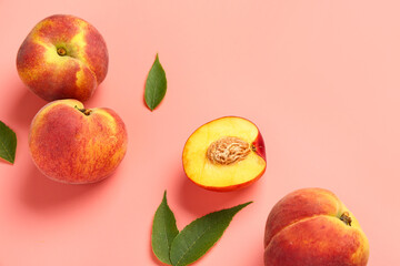 Sweet peaches and leaves on pink background
