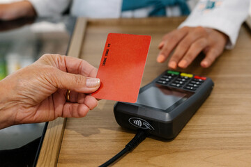 Payment with card in pharmacy using contactless POS terminal