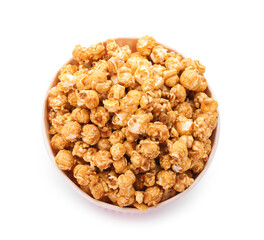 Bucket of tasty caramel popcorn isolated on white background