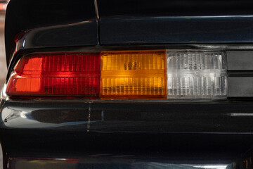 Rear car light. Transportation background