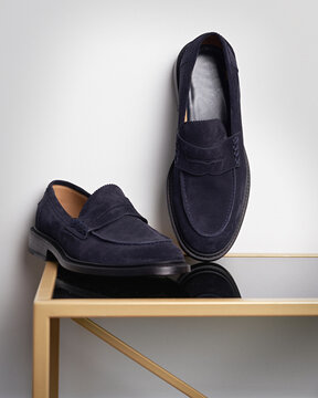 Blue Suede Loafers on Table