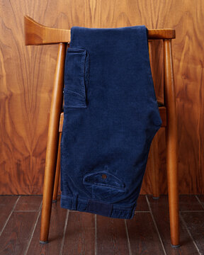 Blue Corduroy Pants Hanging on Chair