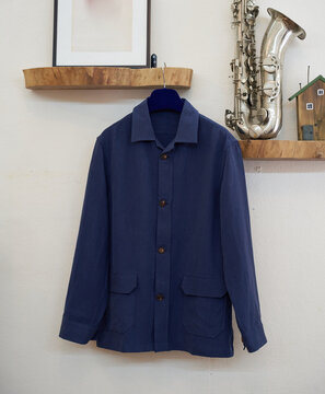 Blue Utility Shirt on Wooden Shelf