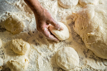 Hands pie dough. Cooks dough for baking, pieces of raw dough. Womans hands rolling doughs for pies....