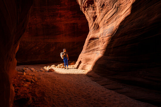 Traveler hiking Buckskin Gulch Slot Canyon