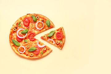 Tasty pizza with olives, tomatoes and basil on yellow background