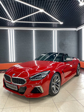 Red cabriolet BMW Z4 G29 M Sport Roadster Convertible in showroom. Exterior cabrio BMW Z4, luxury coupe manufactured by the German automobile manufacturer BMW.