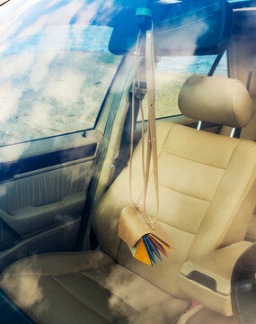 Leather Bag Hanging on Car Rearview Mirror by the Beach