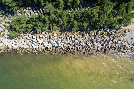 Uzava, Latvia - August 06, 2024. Concrete barriers protect lighthouse Uzava, about 20 kilometers south of Ventspils.