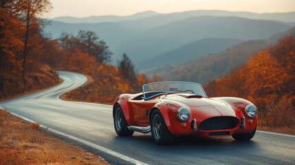 Naklejka premium Classic sports car on a winding mountain road