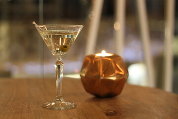 Martini glass with an olive