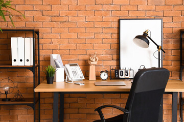 Modern workplace with telephone in interior of office