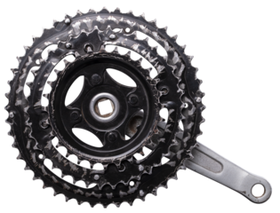 Heavily worn bicycle sprocket and crank on an isolated background.