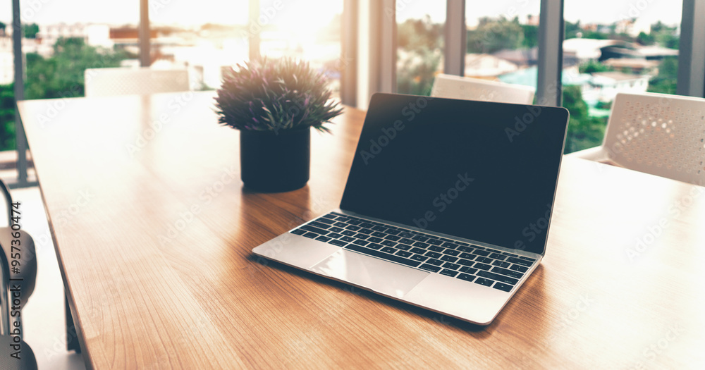 Poster laptop computer with opened lid on table in office workspace. uds