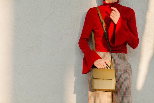Fashionable Woman Wearing Red Sweater and Plaid Pants