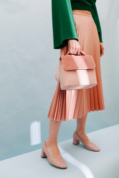 Fashionable Woman Holding Pink Handbag In Stylish Outfit