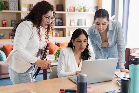 Women working in a team.