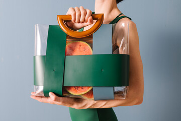 Woman Holding Transparent Bag With Watermelon Slices Inside