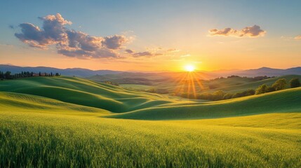 Obraz premium Scenic countryside with rolling hills and a sunset