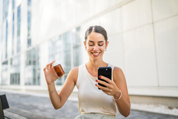 Young woman use mobile phone for read instruction for pills, tablets