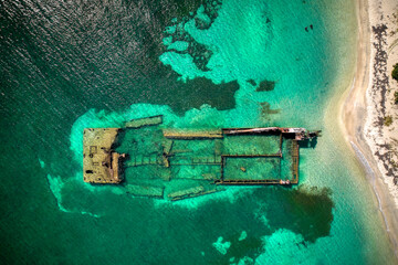 Aerial Drone photos of a sunken shipwreck off the coaast of St. Kitts in clear, tropical water