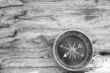 Classic navigation compass on natural background