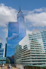 Stunning aerial views of modern urban architecture in New York City. Capture the vibrant mix of contemporary and historic buildings, showcasing the city's dynamic skyline under a dramatic sky.
