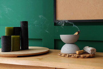 Bowl with Palo Santo and incense on commode in room, closeup