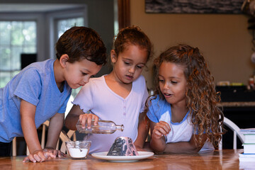 Children Conducting Homemade Volcano Experiment
