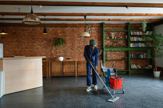 A man washes the floor