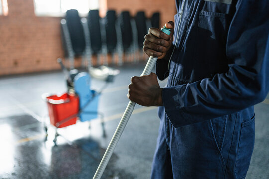 A man washes the floor