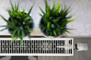 A twisted radiator symbolizing the need to reduce the use of coal, gas and other heat sources....