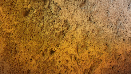 Warm earthy stone texture with golden hues, perfect for natural backgrounds or design elements that need a rustic, organic feel in 4K resolution