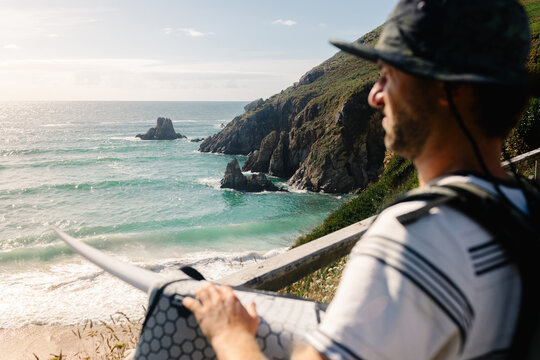 Professional surfer finding the ideal spot for a morning surf practice