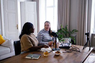 Podcasters discussing serious topics during podcast online streaming