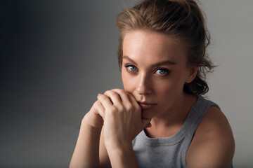 Thoughtful Woman Resting Chin on Hands

