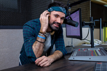Man working in professional music studio with modern equipment broadcasting live show