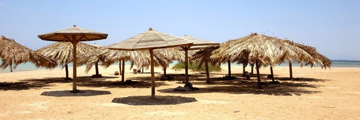 Relaxing Under Beach Umbrellas at Paradise Island in Hurghada Along the Stunning Red Sea Coast