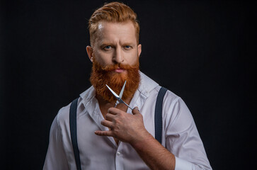 Barbershop. Man hairdressing and barbering. Hairdresser at barbershop isolated on black. Hairdresser man. Professional barber man hold scissors. Handsome hairstylist with haircut. Classic retro