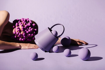Conceptual Art with Purple Balls and Bucket on Purple Background
