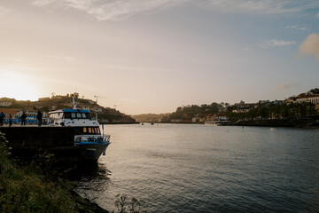 Fototapeta premium boats in the harbor of porto at sunset 