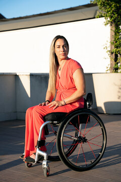 Condident Woman in wheelchair in the street
