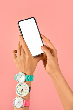 Female Hand Holding Smartphone With Watch on Pink Background