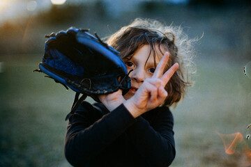 Boy flashes peace sign