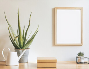Modern Home Decor: Aloe Plant, Watering Can, and Metal Box in Poster Frame Mockup