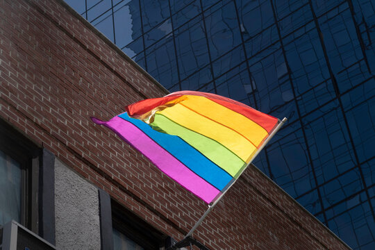 LGBTQ+ pride rainbow flag in the air