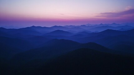 Obraz premium A stunning panorama of a mountain range during sunset viewed from a hilltop vantage point